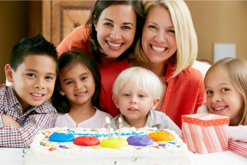 two woman and children celebrating birthday